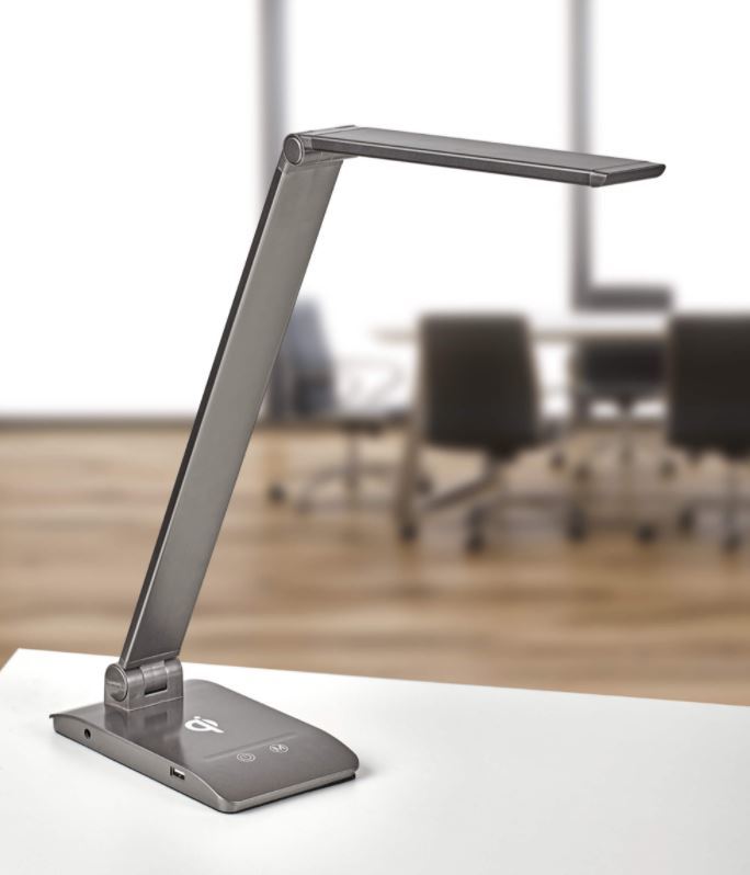 Bureaulamp Astel in antraciet op een bureau in een vergaderruimte