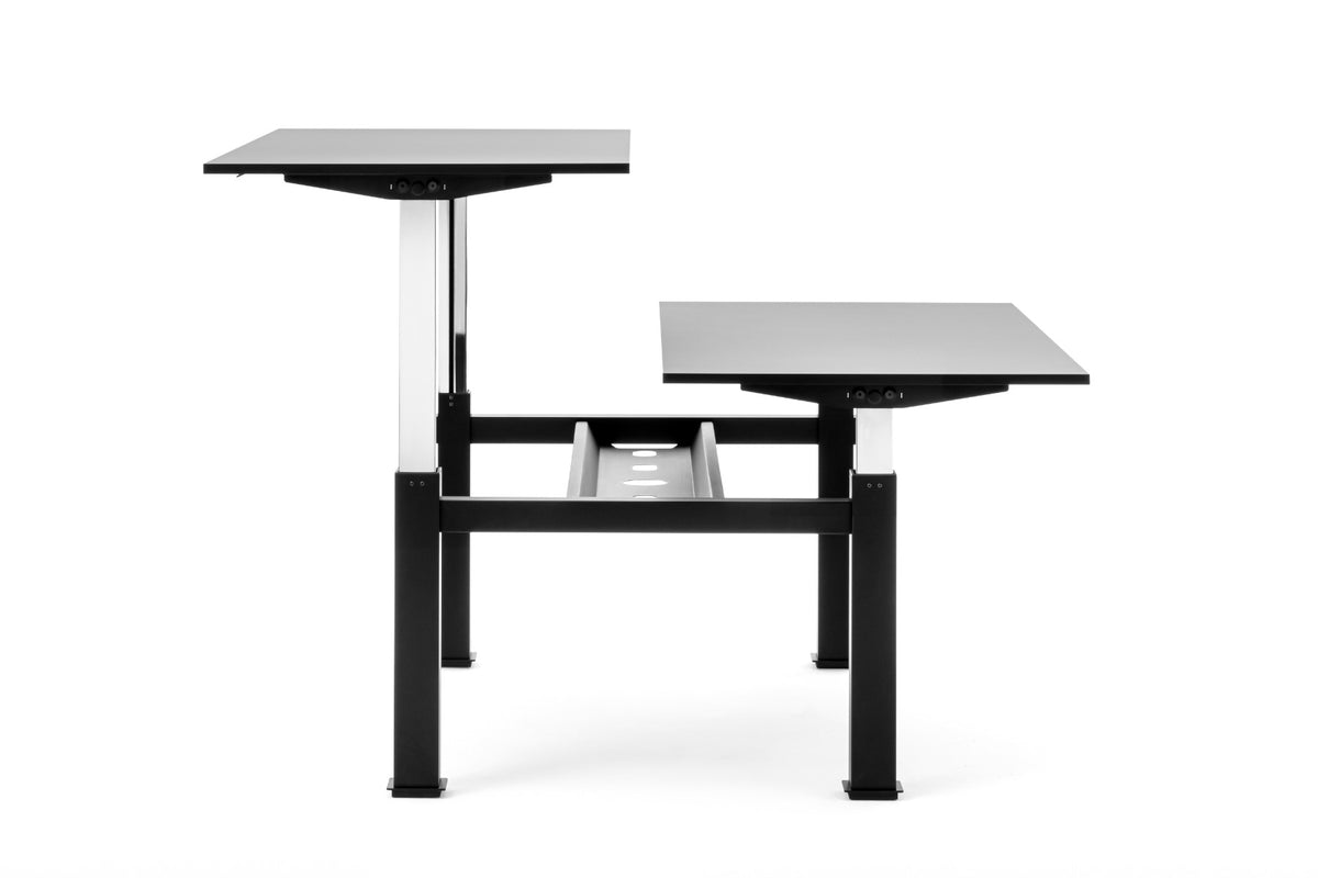 Follow Desk Bench met zwart frame en grijze bladen, zijaanzicht met een blad in stahoogte