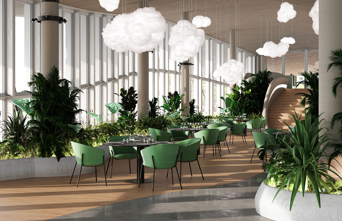 Conga stoelen in groen in een kantine met planten
