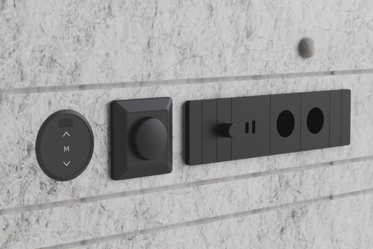 Bediening in de belcel: knoppen voor de hoogteverstelling van het werkblad, draaiknop voor de dimbare verlichting en een blok met schakelaar, usb-poorten en twee stopcontacten